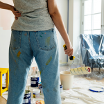 woman with paint roller in hand