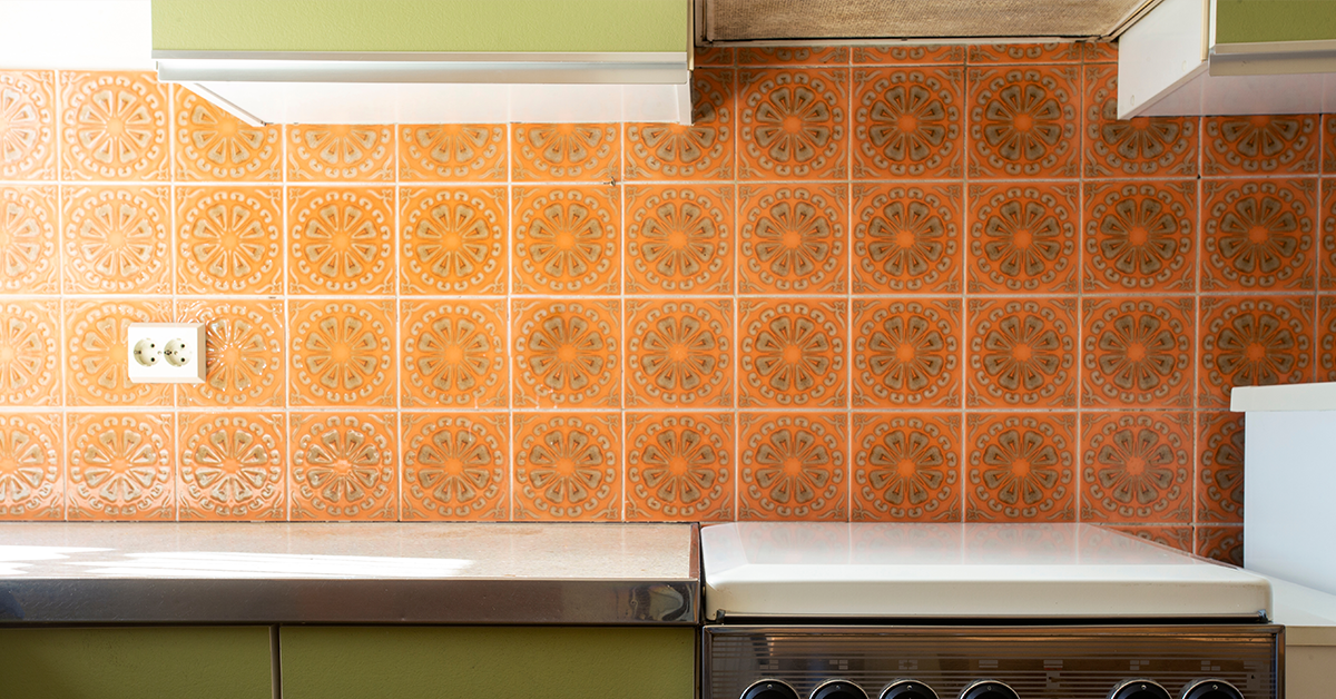 Kitchen painted in green and organce colour combination