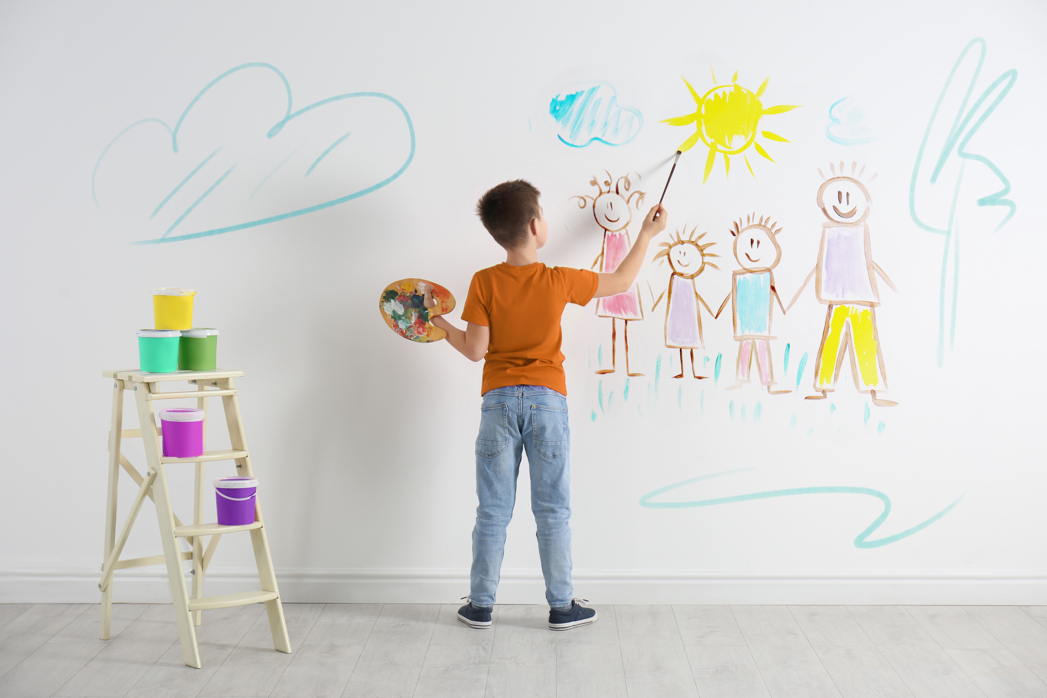 Child drawing on the wall