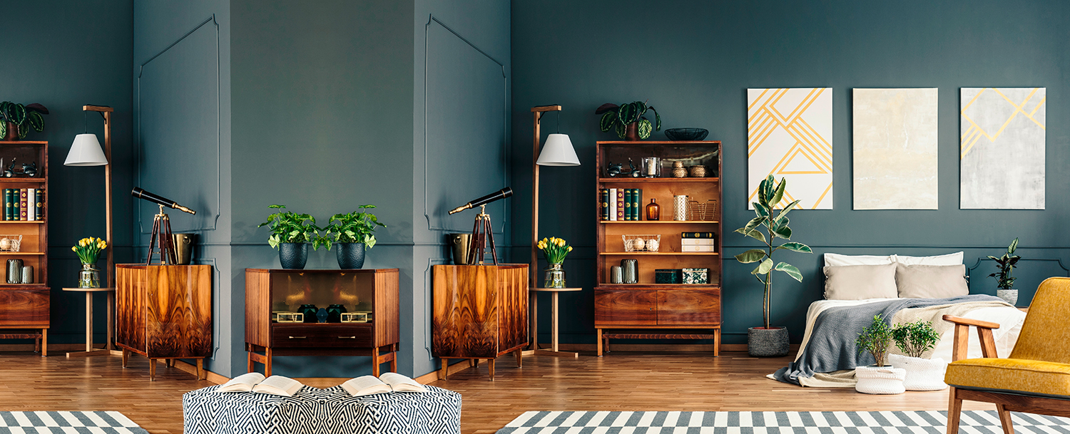 Dark Blue Walls Of A Bedroom With Wooden Furniture