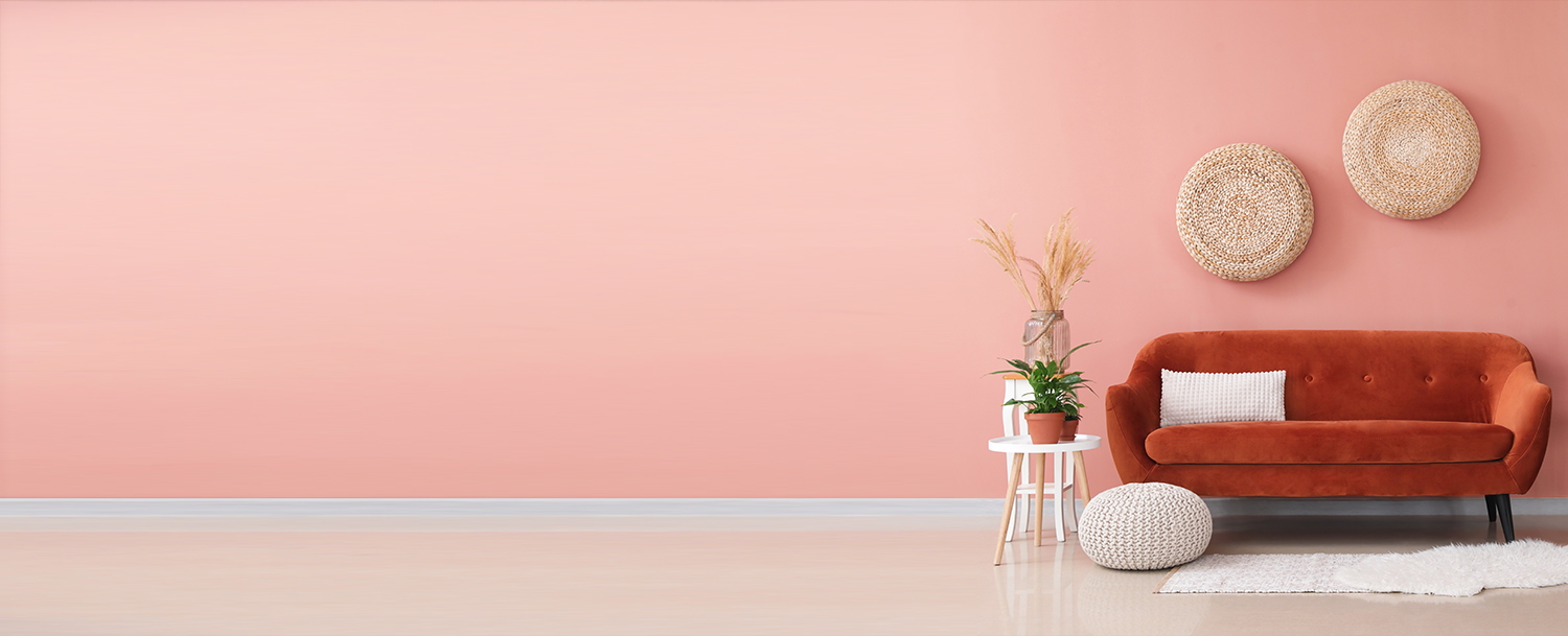 Brown Sofa Complimenting Pink Wall